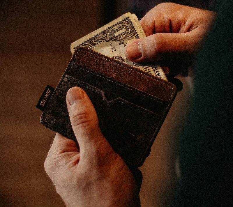 Person taking money out of a wallet