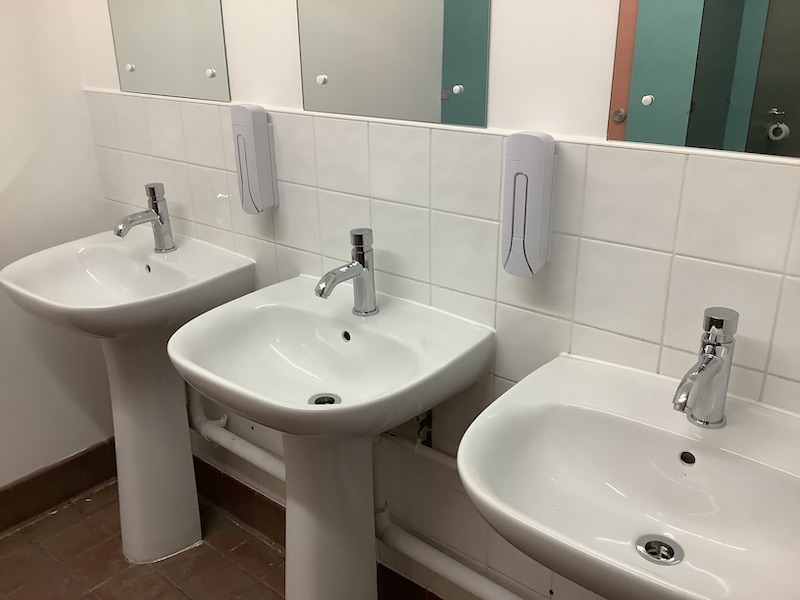Sinks in one of our washrooms with the newly-fitted taps